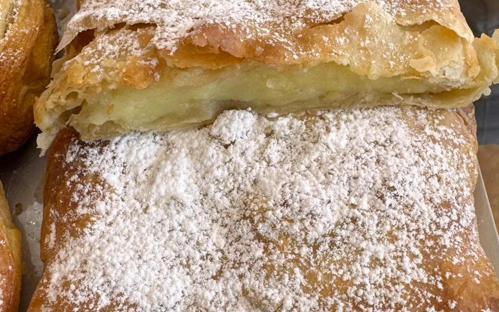 Bougatsa custard cream pastry dusted with powdered sugar, Bakery Kissamos